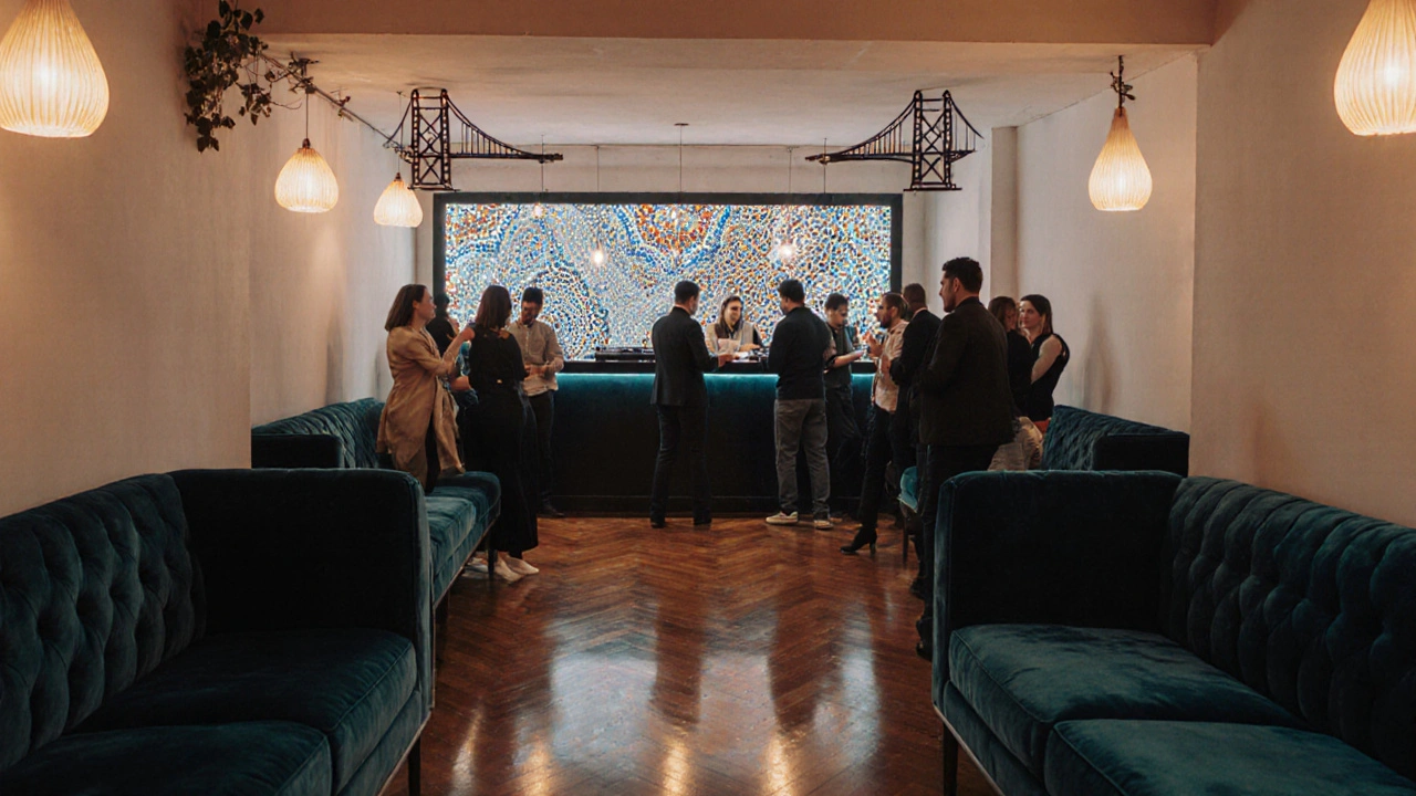 Interior lounge with velvet sofas, LED wall, and DJ booth on a dancing crowd.