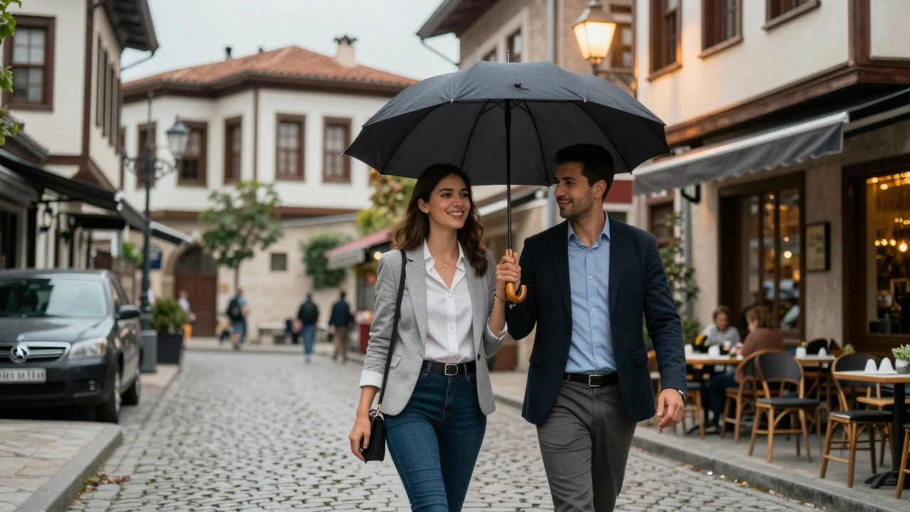 A professional woman and client walking together under an umbrella in Gebze, surrounded by historic streets and soft evening light.