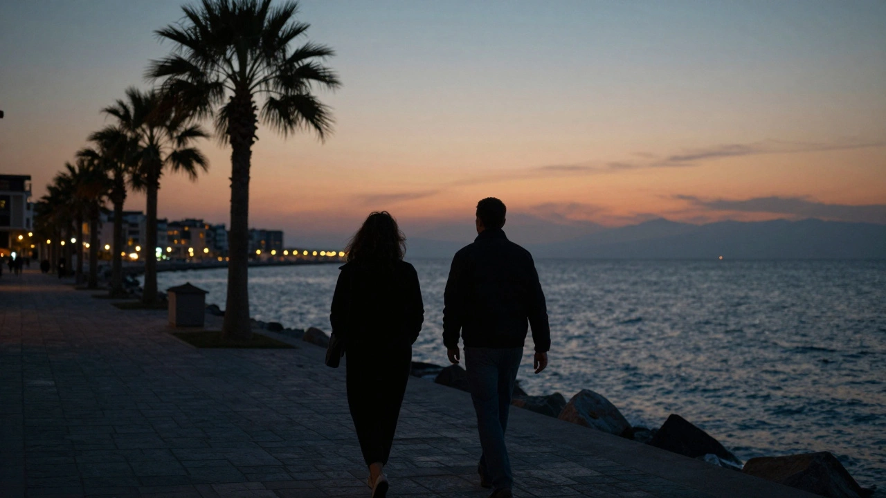 A couple walking peacefully along the Kartal coastline at twilight.