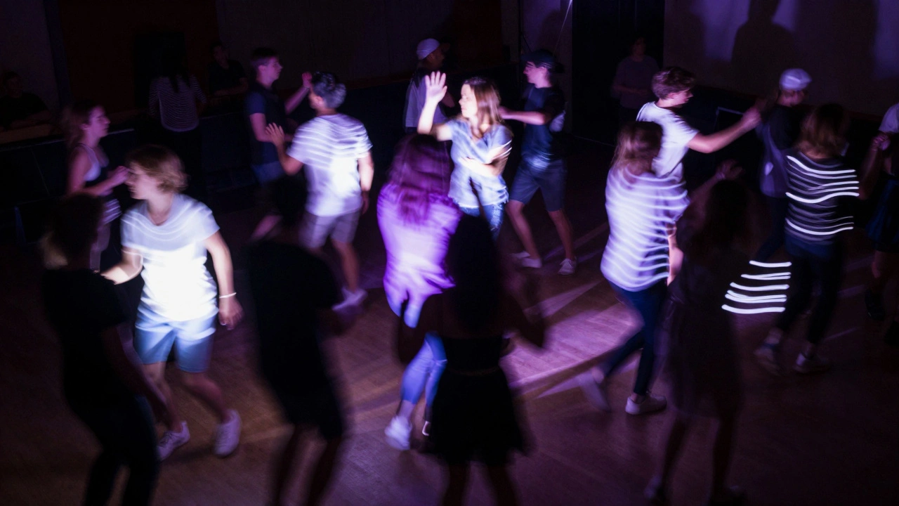 Long exposure light trails of synchronized dancers on dark floor