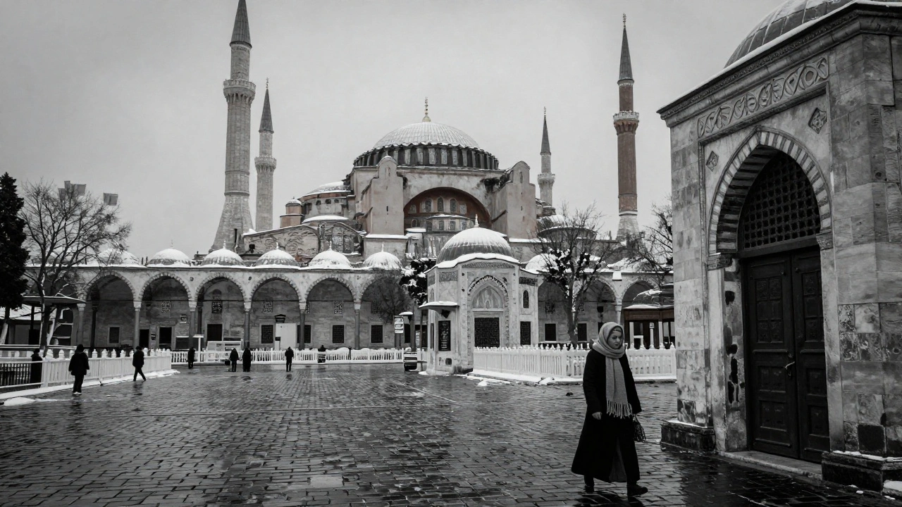 Winter snow softly covering the domes of Istanbul's historic mosques on an empty street.